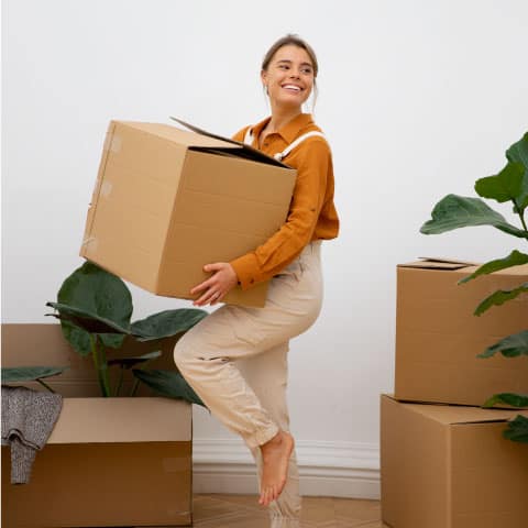 woman carrying moving box