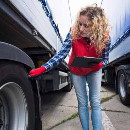 Interstate moves page image of a female truck driver checking her truck