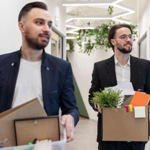 Moving office page image of 2 men carrying office supplies in boxes