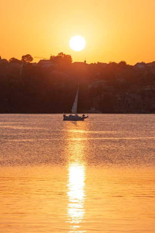 Removalists Deception Bay sailboat in the sunset image