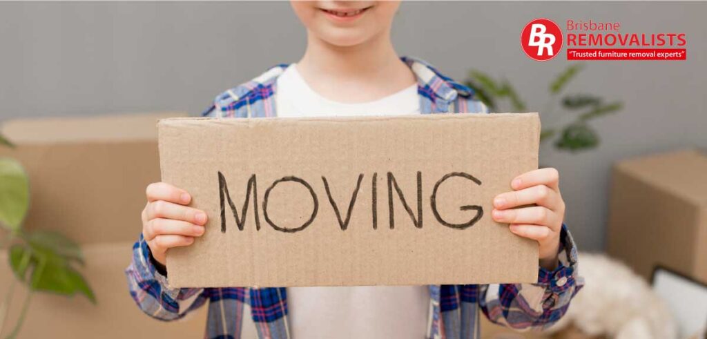 Booking the right removalists article image of a boy holding a cardboard sign