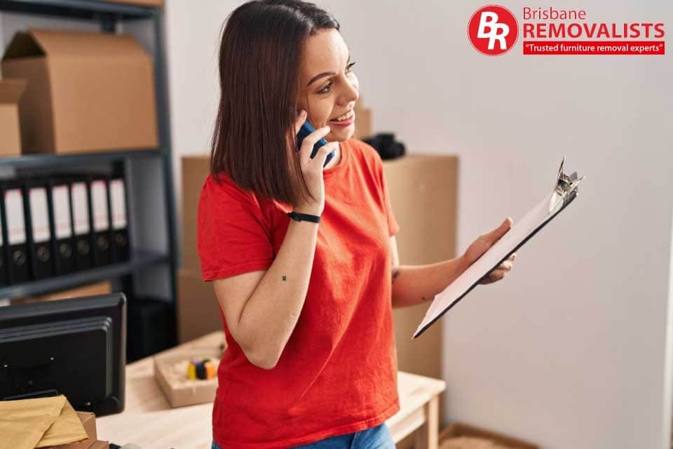 Moving checklist 2024 article image of a happy woman on the phone