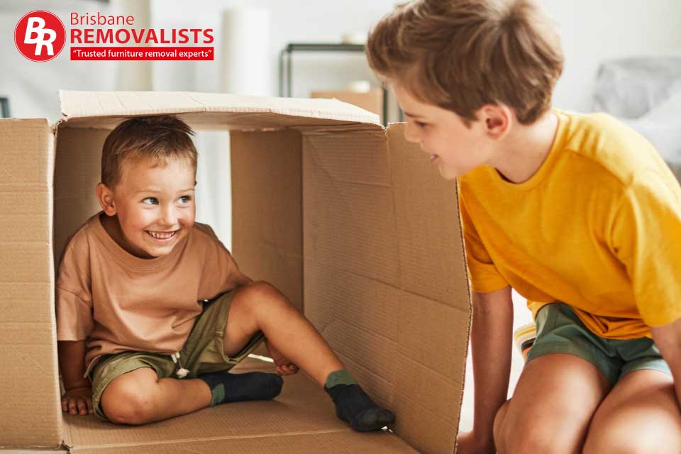 Move with children article image of 2 boys playing in a box