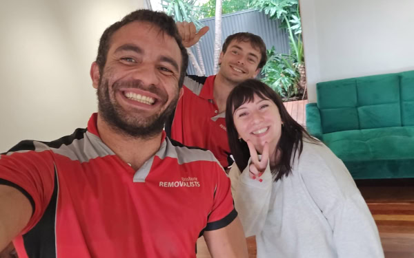 image of 2 of our team members and one very happy clients all smiling