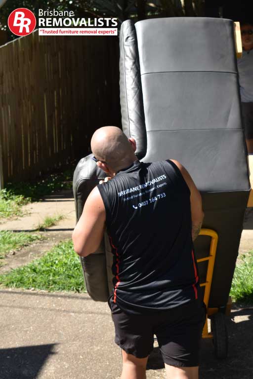 Removalists Paddington image of one of our team moving a lounge