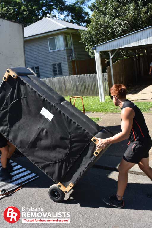 Removalists Sandgate image of one of our team loading a lounge