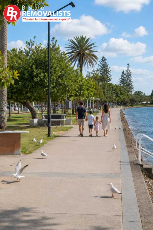 Removalists Bayside an image of a family walking by the shoreline
